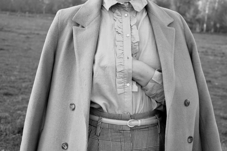 Midsection of woman with hand on chest