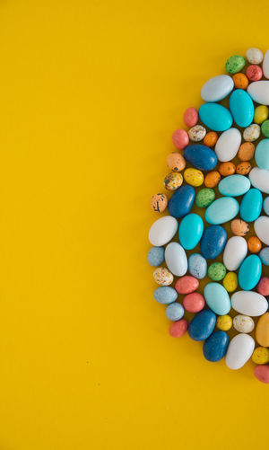 Directly above shot of medicines on yellow background
