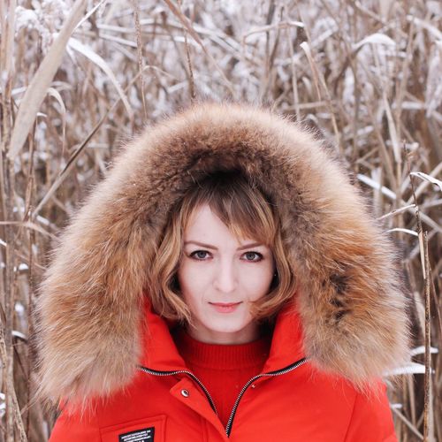 Portrait of woman wearing fur coat during winter