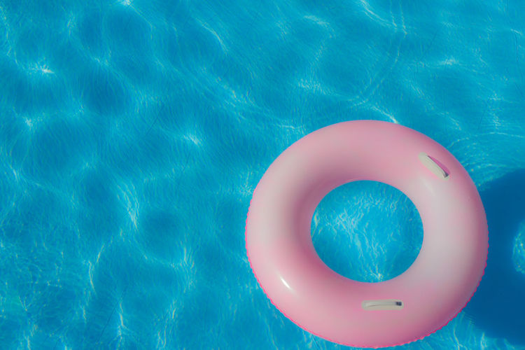 High angle view of pink inflatable ring floating on water