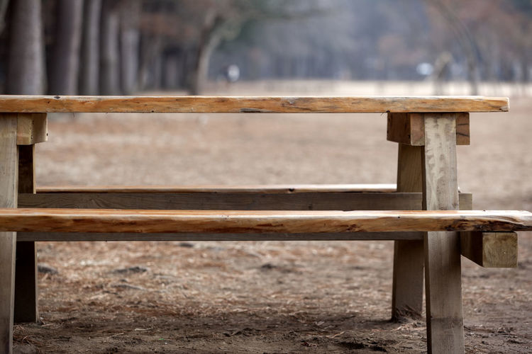 Wooden bench on field