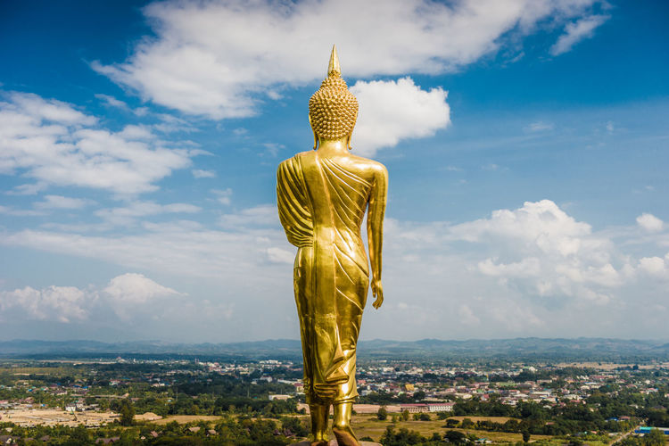 Statue of buddha against sky