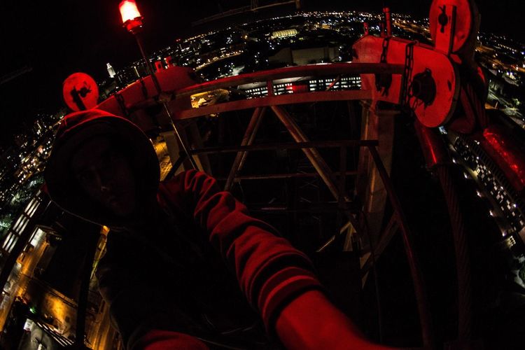 Low angle view of illuminated lights at night