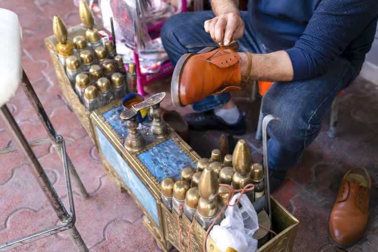 Professional shoe shine in turkey. the process of working of shoe shine on the street of antalya.