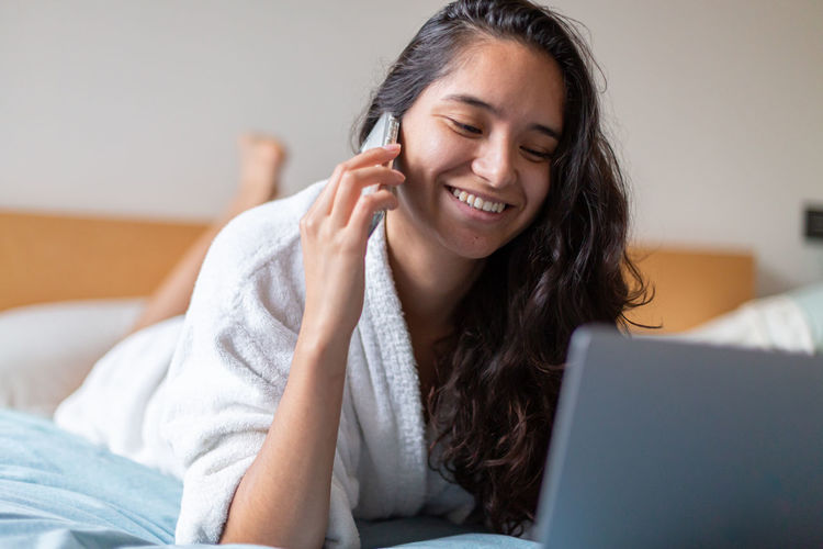 Young woman using laptop at home