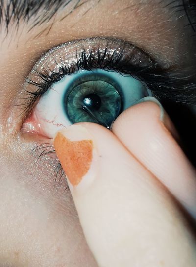 Close-up of human eye with contact lense