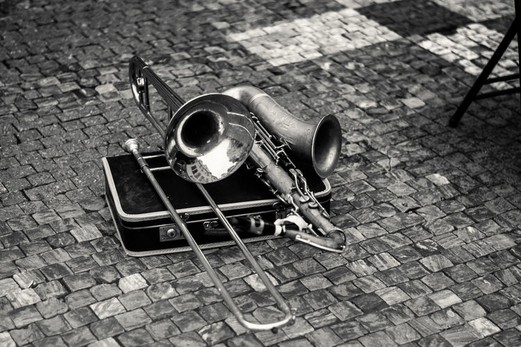High angle view of musical instruments on cobblestone street