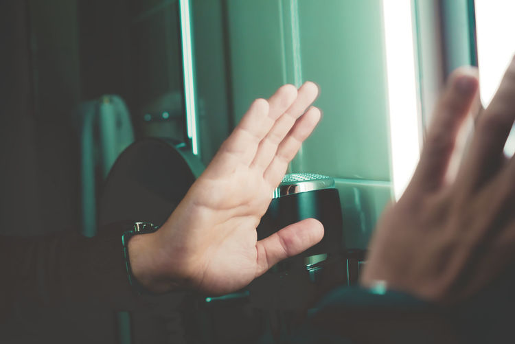 Midsection of man holding glass