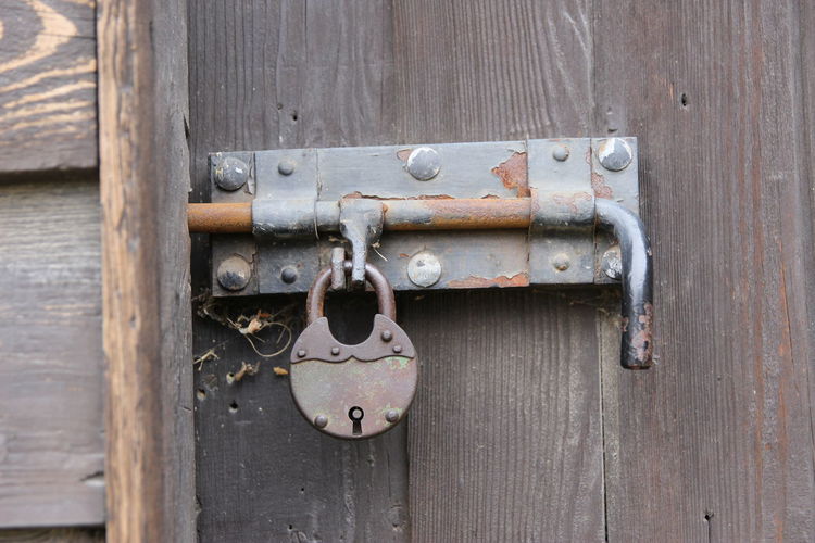Close-up of padlock on door
