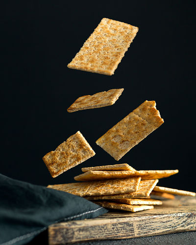 Creative concept with falling food on black backdrop