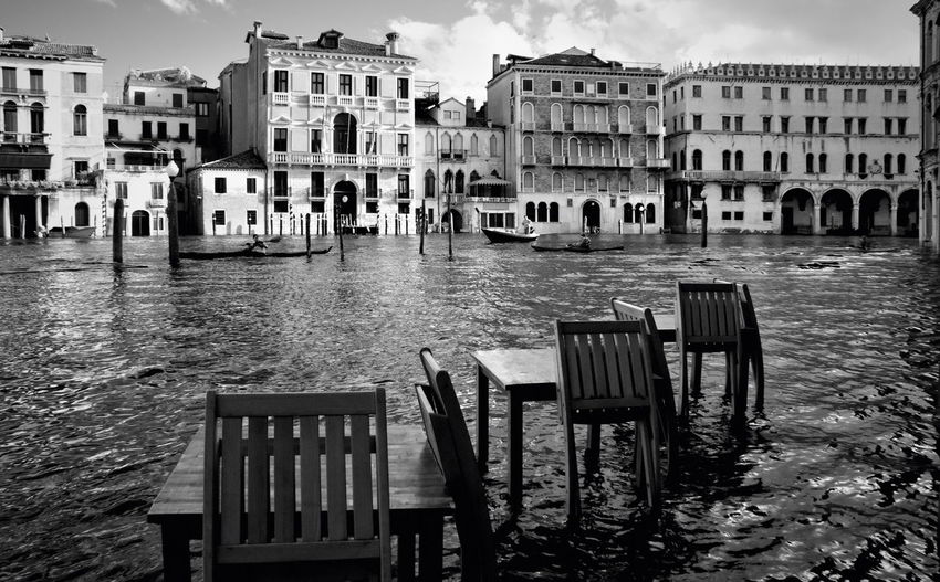 High angle view of chairs and tables arranged in flooded street