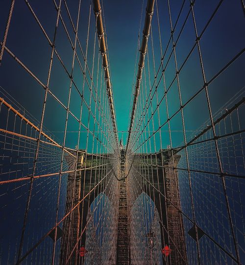 Low angle view of brooklyn bridge against sky