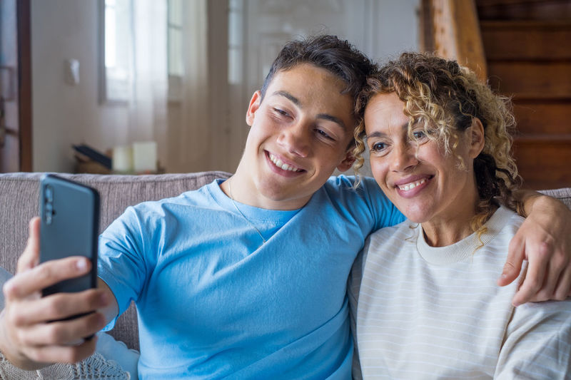 Portrait of young man using mobile phone