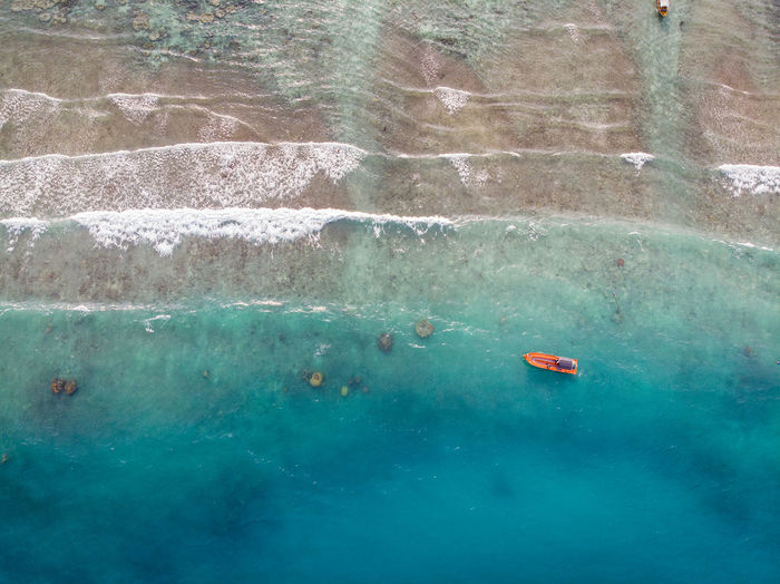 Aerial view of boat moving on sea