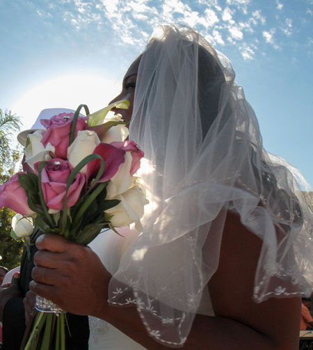 Close-up of bride holding bouquet
