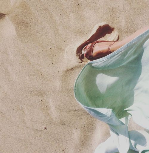 Womans feet on sand