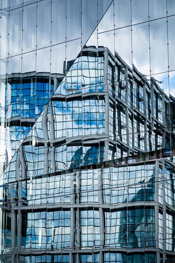 Full frame shot of modern building in city against sky