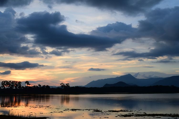 Scenic view of lake against sky during sunset