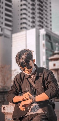 Man sitting outside building