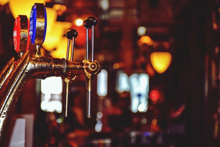 Close-up of beer tap at bar