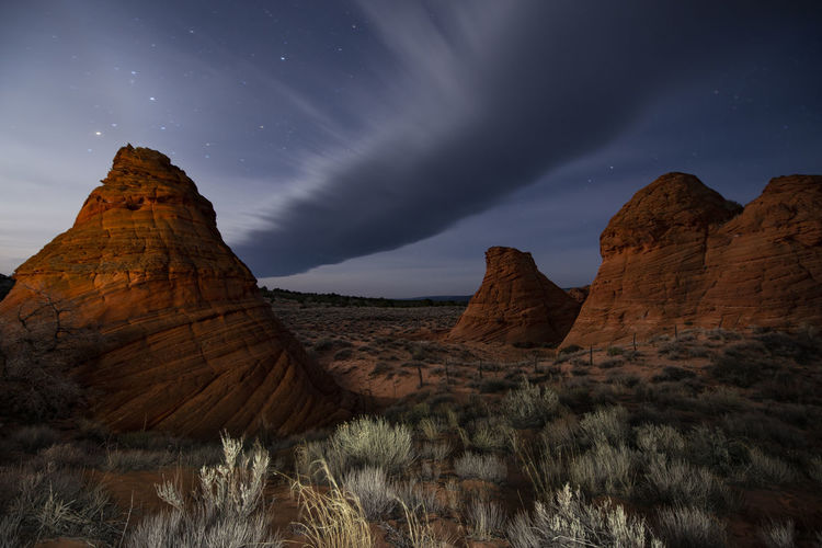 Red sandstone rock formation in remote arizona desert under a st