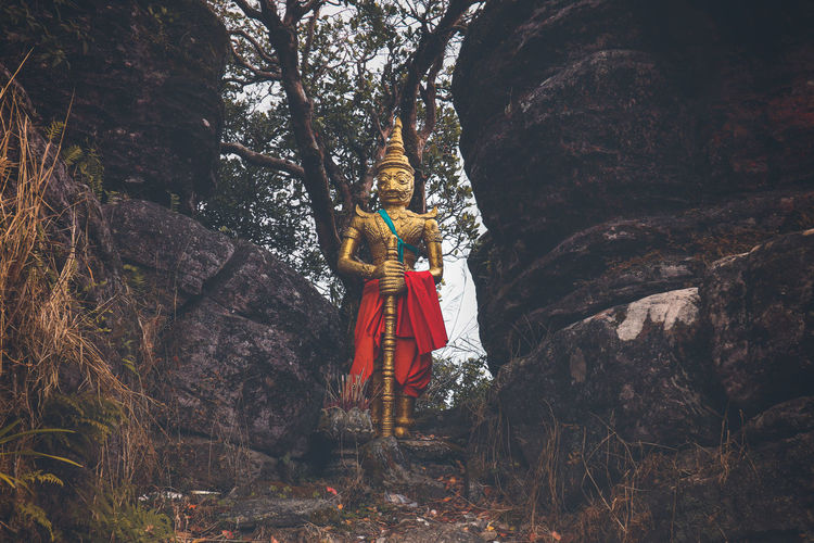Golden buddhist statue in sampov pram pagoda in bokor national park in kampot cambodia