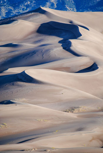 Light and shadow on sand dunes in colorado