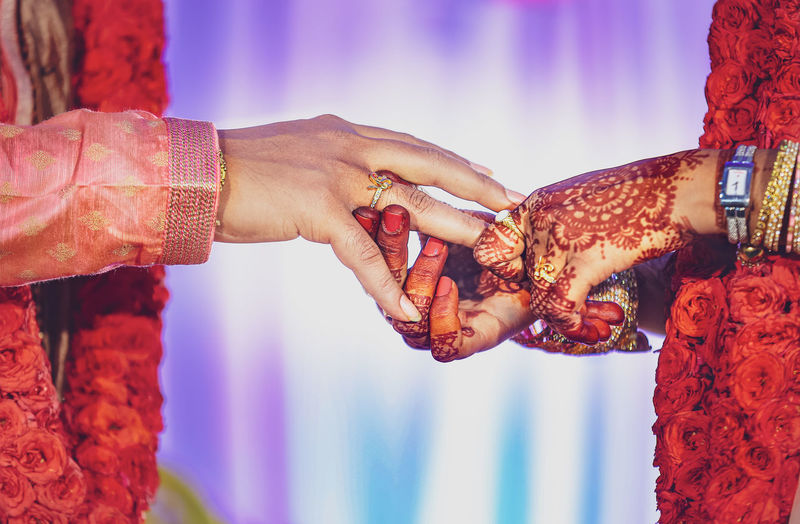 Low angle view of couple holding hands