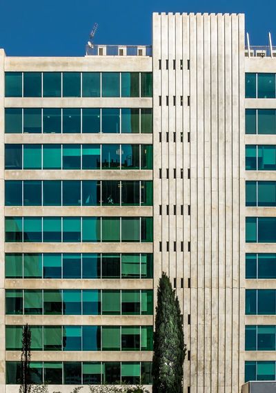 Modern office building against clear sky