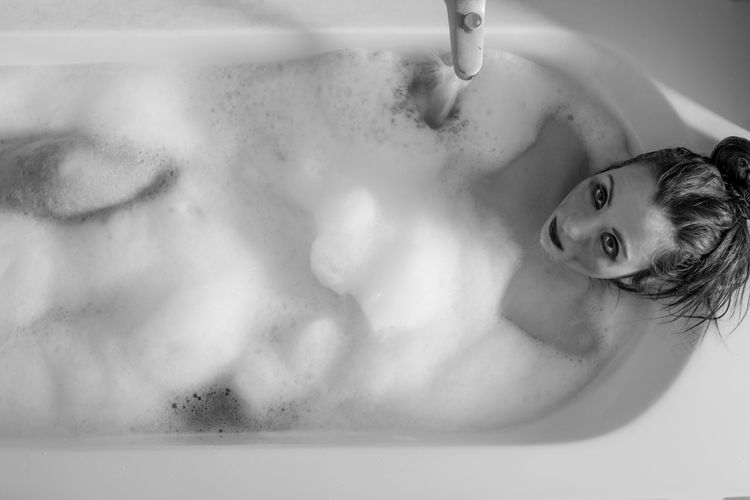 High angle portrait of woman in bathtub