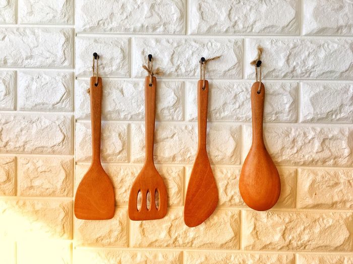Wooden spoons hanging on wall