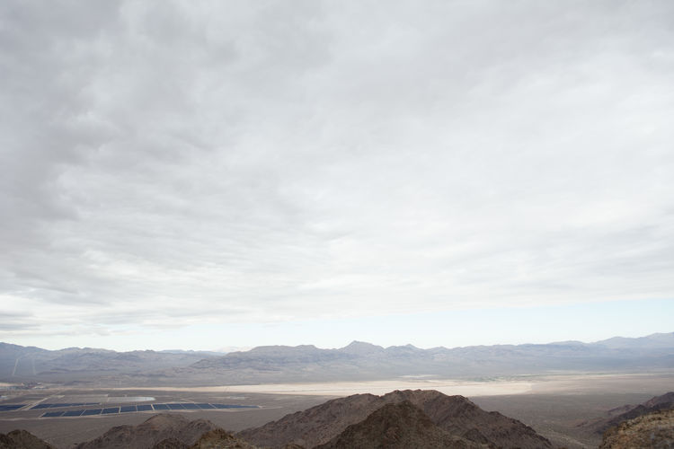 Scenic view of landscape against cloudy sky
