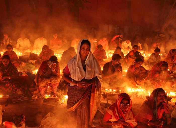 Women standing inside croud in rakher upobash