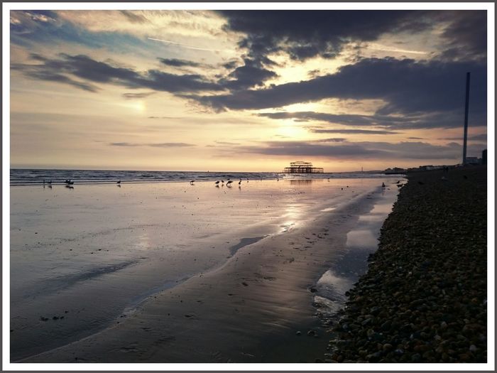 Scenic view of sea at sunset