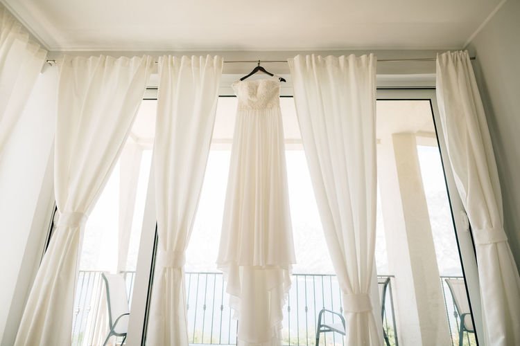 LOW ANGLE VIEW OF WHITE CURTAIN
