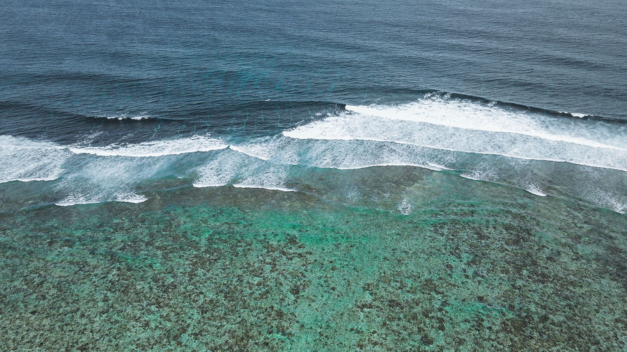 High angle view of sea waves in maldives 