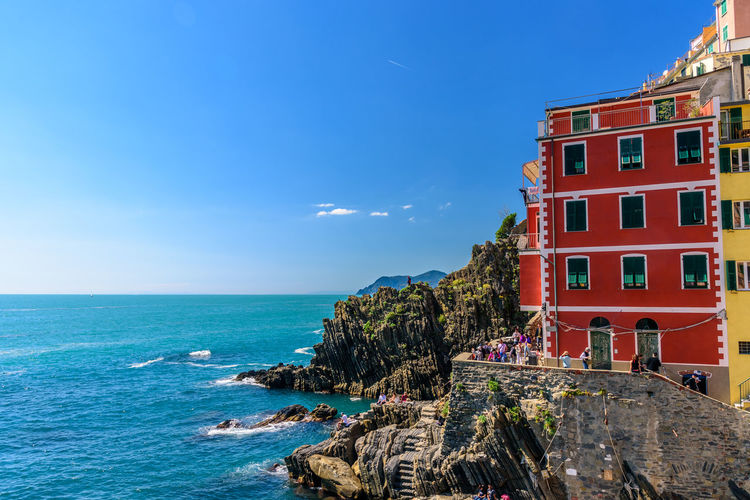 Building by sea against sky at riomaggiore