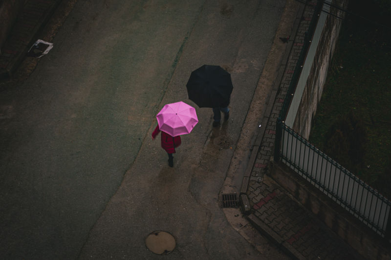 High angle view of woman walking on street