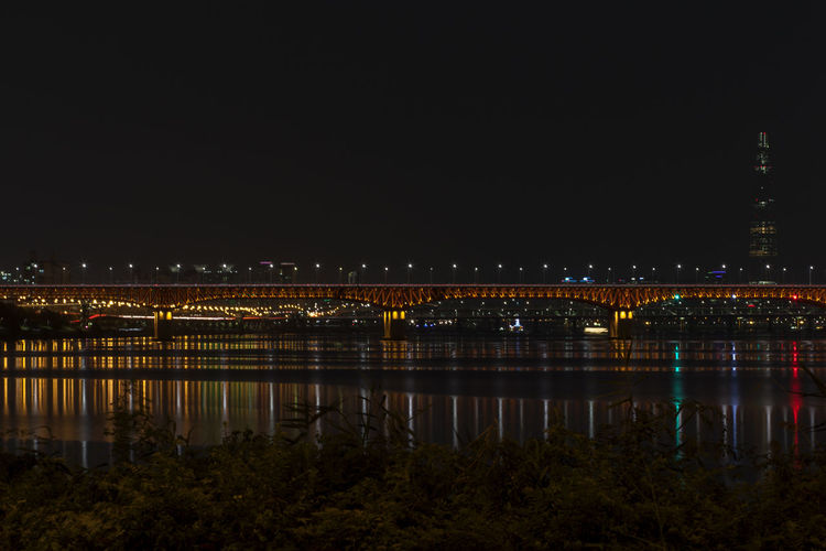 Illuminated bridge over han river at night
