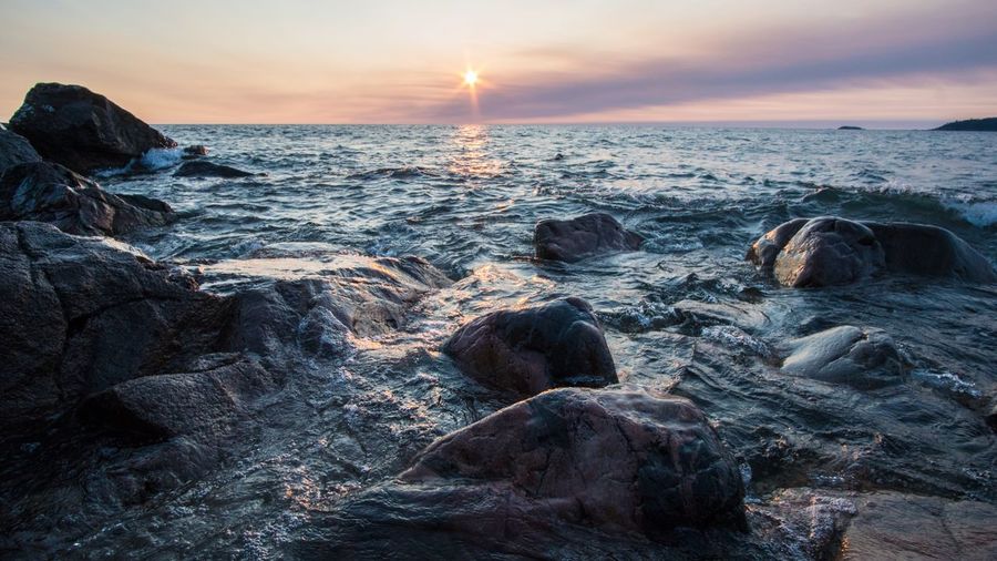 Scenic view of sea against sky during sunset