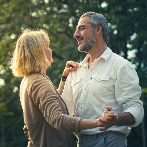 Rear view of couple standing outdoors