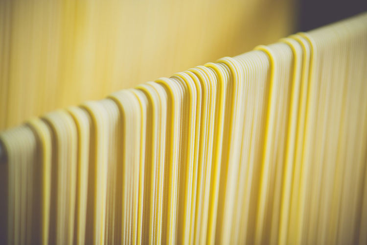 Close-up of spaghetti drying in factory