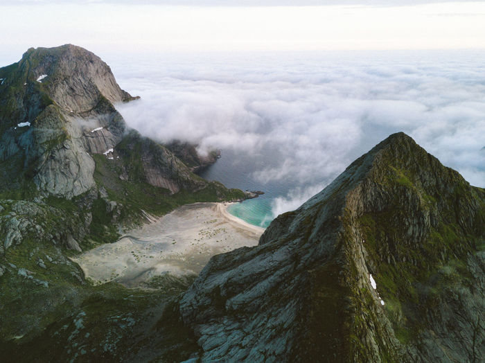 Scenic view of mountains and sea against sky