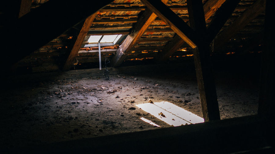 Empty chairs and table in abandoned building