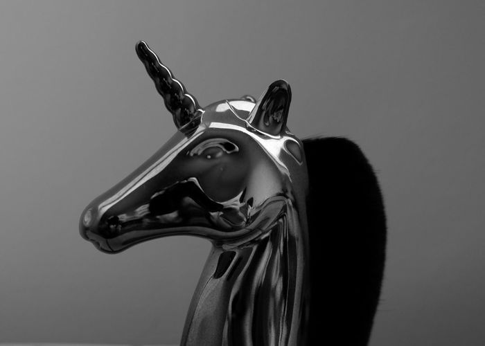 Monochrome close-up of a decorative unicorn figurine