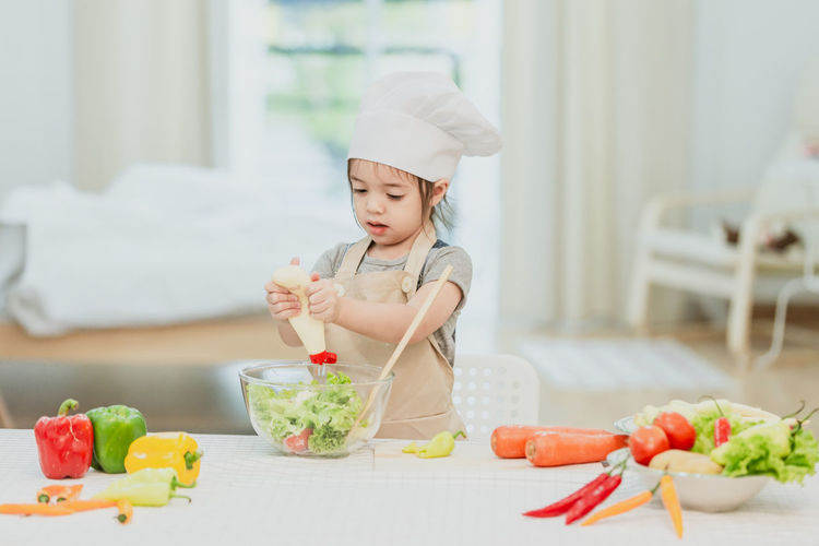 Midsection of woman preparing food on table