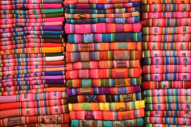 Full frame shot of multi colored woolen blankets for sale
