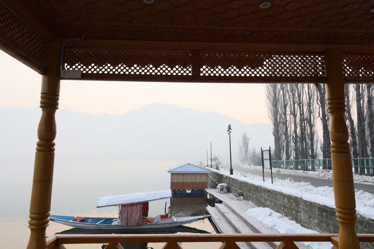Panoramic view of building and mountains against sky, dal lake srinagar kashmir 