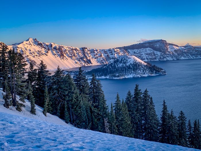 Scenic view of snowcapped mountains against sky during winter