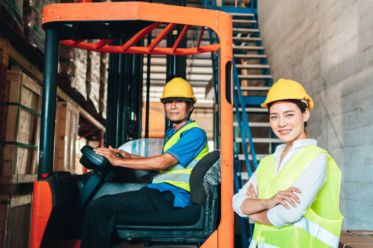 Portrait of worker and engineer at factory